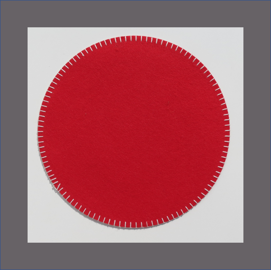 red-round-placemat-with-white-stitch-felt